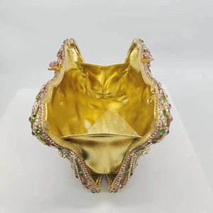 Elegant gold wavy rhinestone clutch bag with multicolored crystals for formal parties