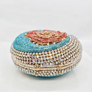 Luxury round clutch bag with red rose rhinestone pattern and silver metal frame