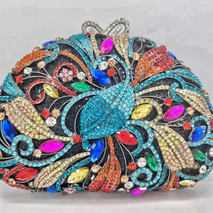 Luxury multicolor crystal clutch bag featuring vibrant radial rhinestone peacock patterns