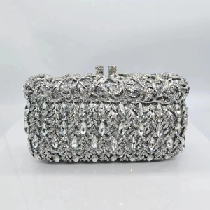 Elegant silver hollow metal evening clutch bag encrusted with sparkling crystals