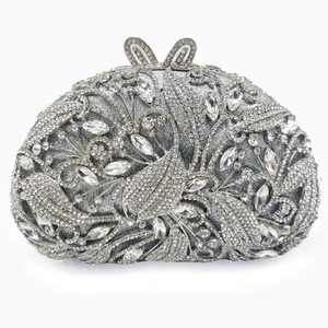Elegant silver crystal clutch bag with floral rhinestone patterns and bunny ear clasp