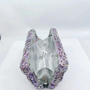 Luxury purple crystal clutch bag with hollow metal design and sparkling diamond finish