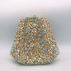 Macro detail of luxury trapezoid evening clutch featuring colorful crystals and floral motifs