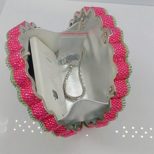 Sparkling watermelon clutch bag with rhinestones, metal frame and silver chain strap
