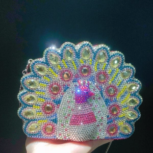 Luxurious peacock shaped evening clutch bag encrusted with colorful crystals and gems