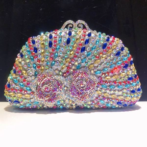 Close-up of D-shaped evening clutch with multi-colored crystals and hollow metal frame