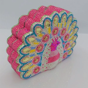 Detailed view of peacock rhinestone evening bag with pink and colorful crystal embellishments