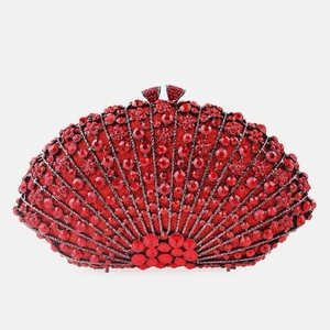 Macro view of luxurious fan-shaped evening bag with vibrant red rhinestones and metal frame
