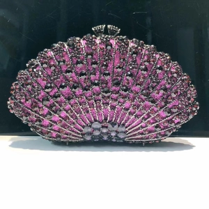 Detailed view of fan-shaped purple clutch bag with sparkling rhinestones and metal clasp