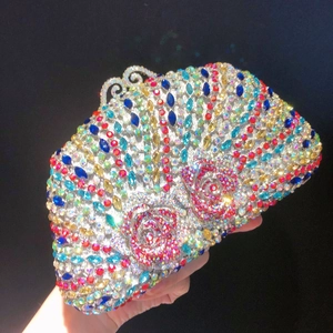 Macro shot of luxury evening clutch with colorful crystals and rose patterns