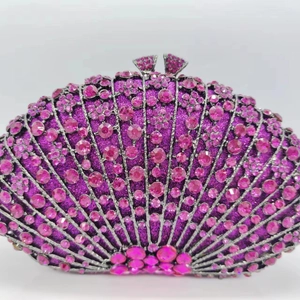 Close-up of fan-shaped evening clutch with pink and purple gradient rhinestones
