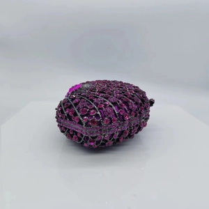 Detail of purple rhinestones and dark metal frame on this luxury evening clutch bag
