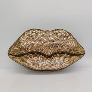 Macro view of crystal encrusted lip-shaped evening clutch bag with gold rhinestone details