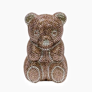 Close-up of a teddy bear evening clutch bag with rose gold crystal rhinestones