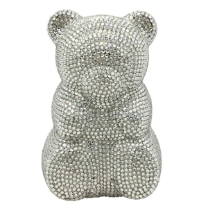 Macro shot of silver crystal gummy bear clutch bag with sparkling rhinestone surface