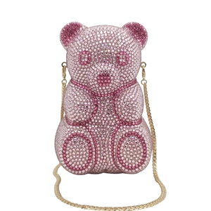 Detailed macro view of pink crystal rhinestones on the bear-shaped party handbag