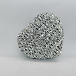 Elegant silver heart shaped evening clutch bag with luxury rhinestones for formal parties