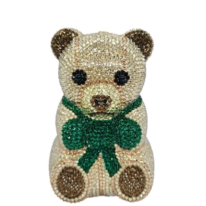 Sparkling crystal bear-shaped evening clutch bag with emerald rhinestone bow detail