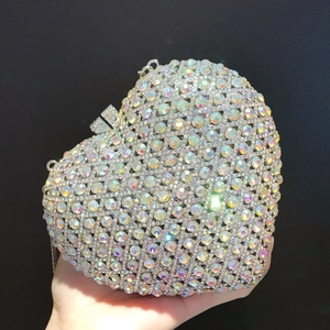 Close-up of heart-shaped clutch bag featuring sparkling AB iridescent rhinestones