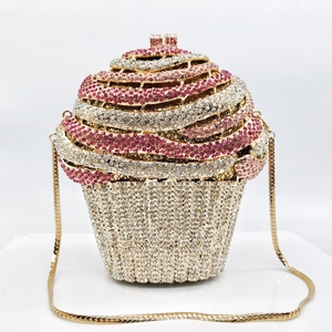 Macro detail of cupcake evening bag with pink and white rhinestones and gold chain