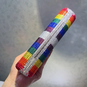 Rainbow crystal evening clutch bag with sparkling rhinestones in a cylindrical shape