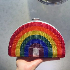 Close-up of a rainbow rhinestone clutch bag with gradient crystals and a metallic clasp