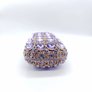 Macro shot of purple and blue rhinestones on a luxury evening clutch bag