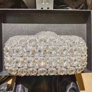 Detail view of silver luxury evening clutch bag with large sparkling crystal rhinestones