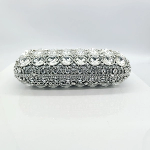 Detailed close-up of sparkling silver rhinestone evening clutch with luxury crystal accents