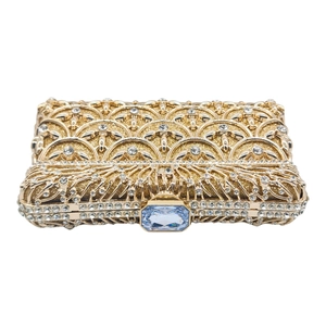 Pochette da sera dorata traforata con strass e chiusura con gemma azzurra di lusso