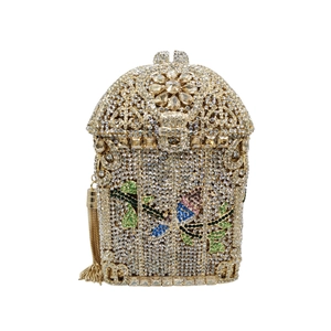 Close-up of birdcage evening clutch with floral crystals and long metal tassels