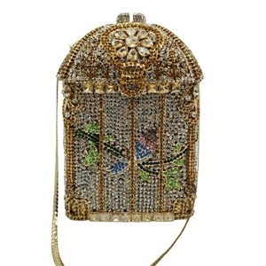 Close-up of birdcage evening bag with colorful rhinestones and floral metal details