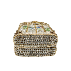 Detailed bottom view of luxury birdcage clutch bag with crystal pavé and gold frame