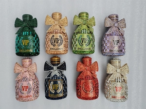 Detailed grid of crystal champagne bottle evening bags with bow ties in eight colors