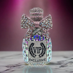 Detail of crystal champagne evening bag with pink rhinestone bow and VIP engraving