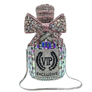 Macro view of luxurious crystal champagne bottle evening bag with pink gradient rhinestones