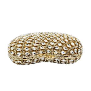 Luxury gold evening clutch bag with teardrop rhinestones on a white background