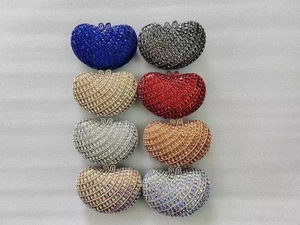 Collection of heart-shaped rhinestone evening clutch bags in eight sparkling vibrant colors