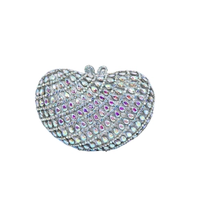 Close-up of heart-shaped evening bag with colorful AB rhinestones and crystal clasp