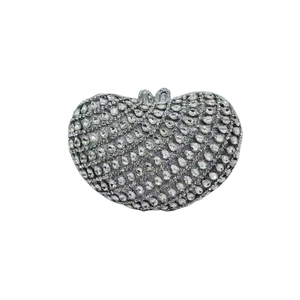 Detailed view of a heart-shaped evening clutch bag fully covered in sparkling rhinestones