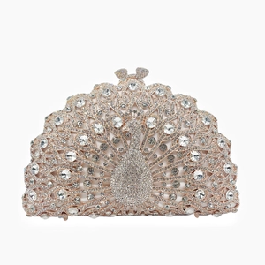 Detailed close-up of rose gold peacock evening clutch with sparkling rhinestones
