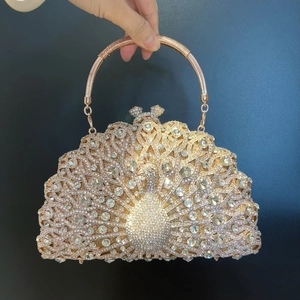 Luxury peacock crystal evening clutch bag with gold metal handle and champagne diamonds