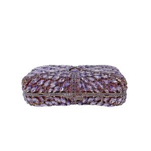 Detail of purple evening clutch featuring radiant marquise rhinestones on a metal frame