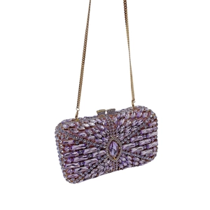 Detailed macro view of purple crystals and radiant floral patterns on the evening clutch