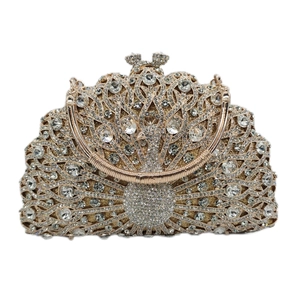 Detailed view of luxury peacock clutch with crystal rhinestones and bow clasp