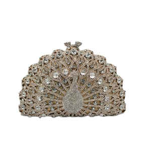 Exquisite close-up of a peacock evening clutch bag with dense rhinestones and sequins