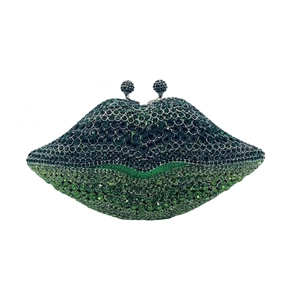 Detailed view of lip-shaped evening clutch with green crystal inlay and metal base