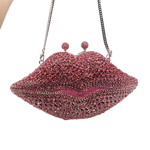 Pink crystal lip clutch bag with rhinestone embellishments and silver chain strap