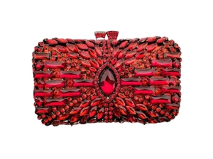 Macro detail of luxury red rhinestone evening clutch bag with intricate crystal embroidery