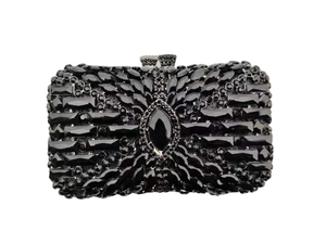Detailed close-up of a luxury black rhinestone clutch with intricate diamond encrusting